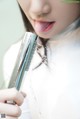 A woman is taking a shower with her tongue out.