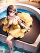 A woman in a yellow dress sitting in a hot tub.